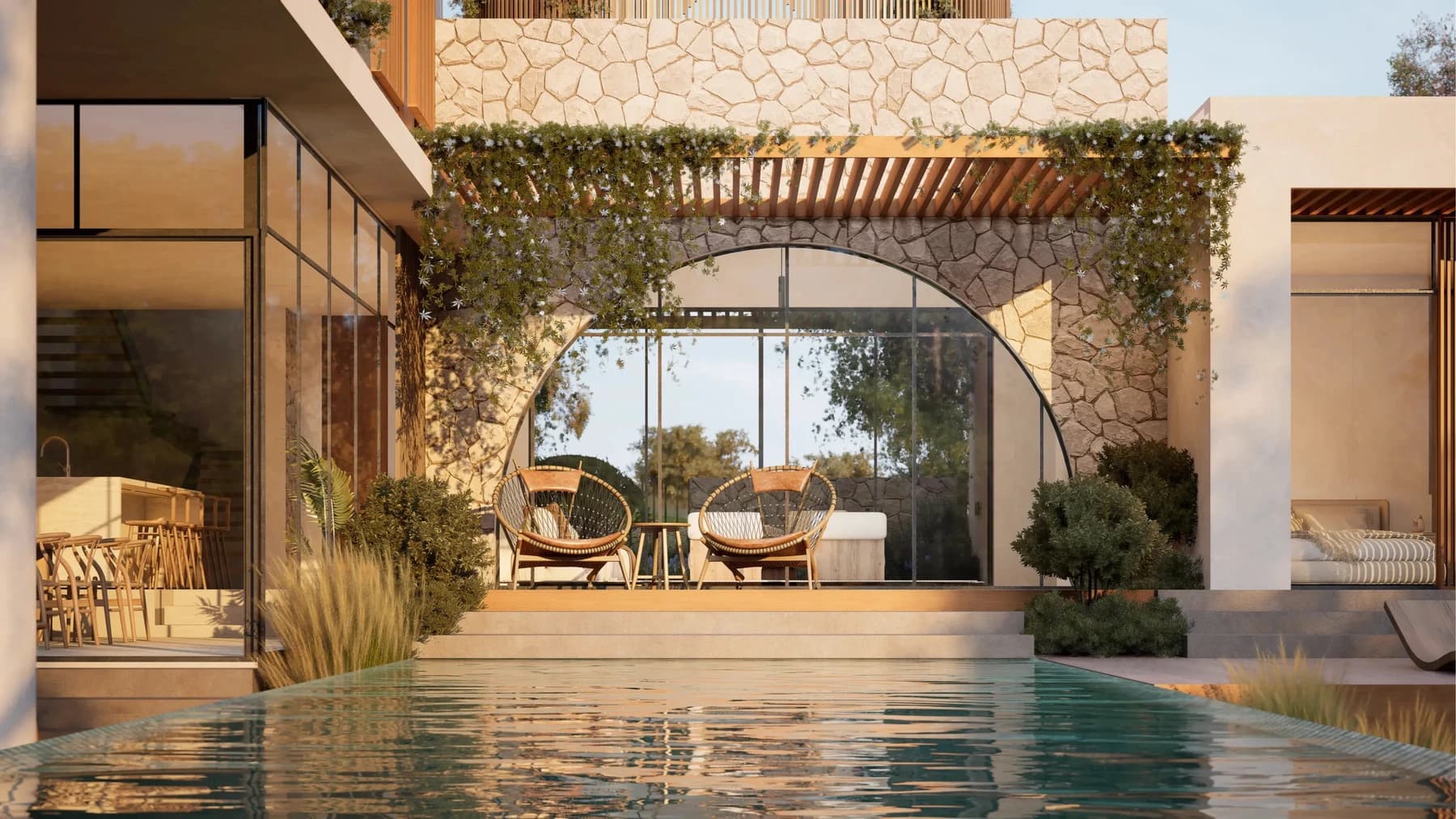 Amari Tulum exterior terrace with arched glass and vine-covered stone.