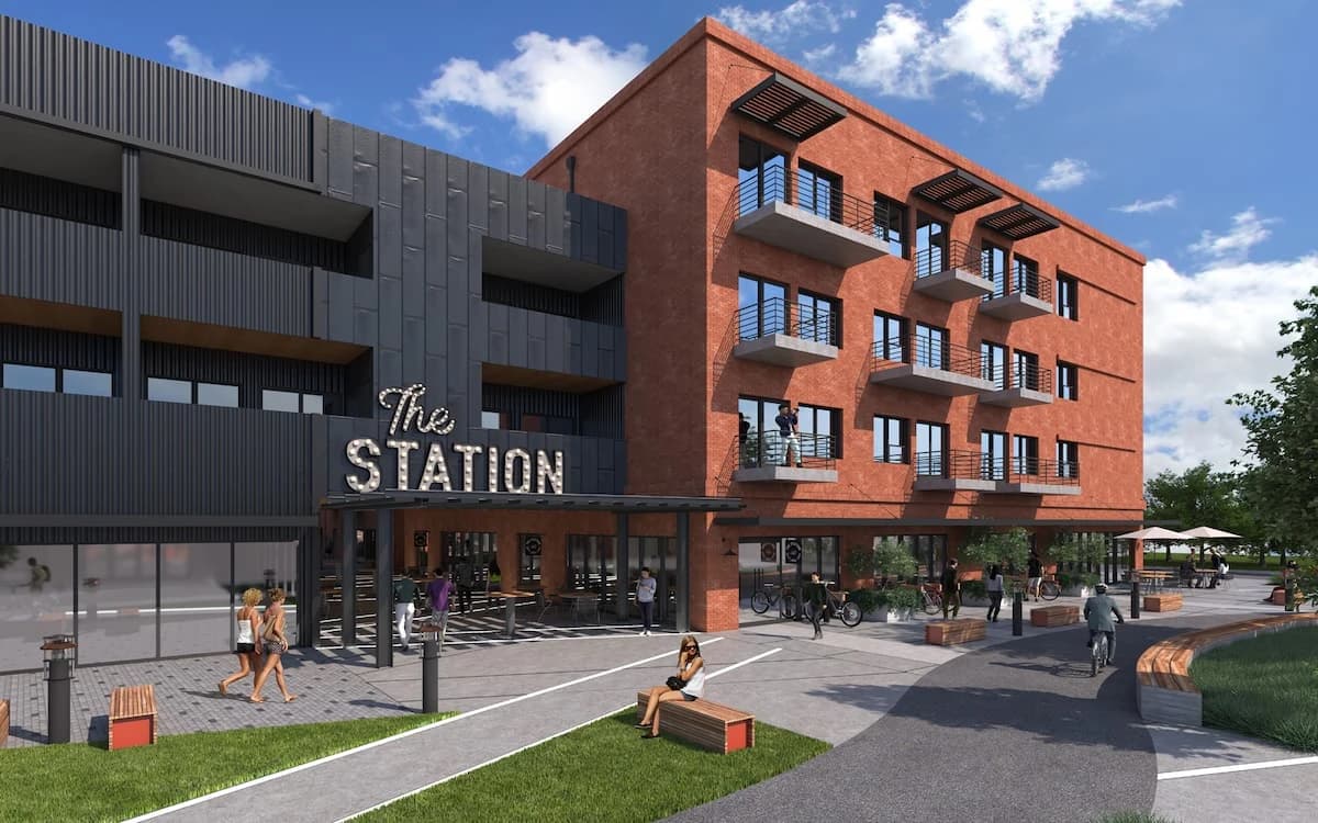 The Station at St. Elmo streetfront with brick and dark metal facades.